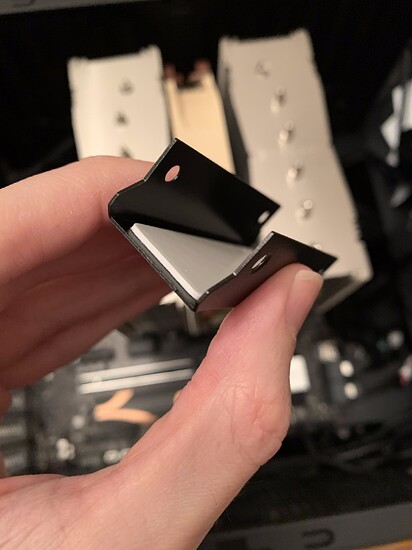This bottom portion raises the NVME drive past the Q screw tip.
